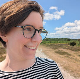 Circular photo of Catherine Pip on a sunny day